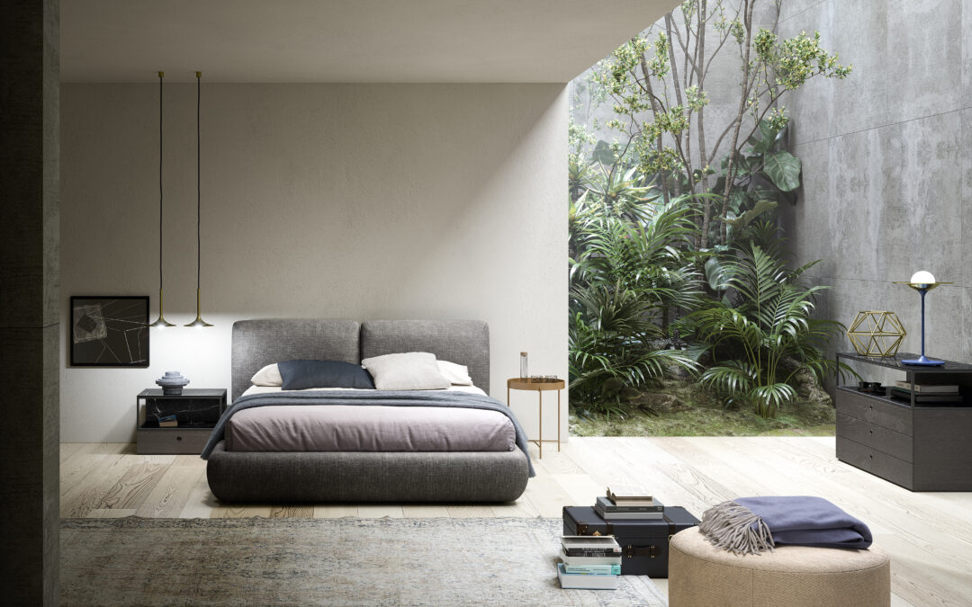 Dormitorio con cama tapizada, mesillas y cómoda
